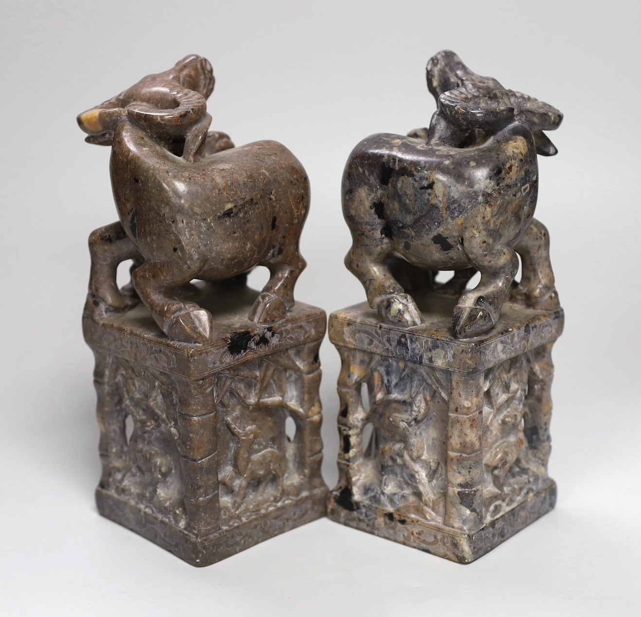 A pair of large Chinese soapstone 'buffalo' seals, 21cm